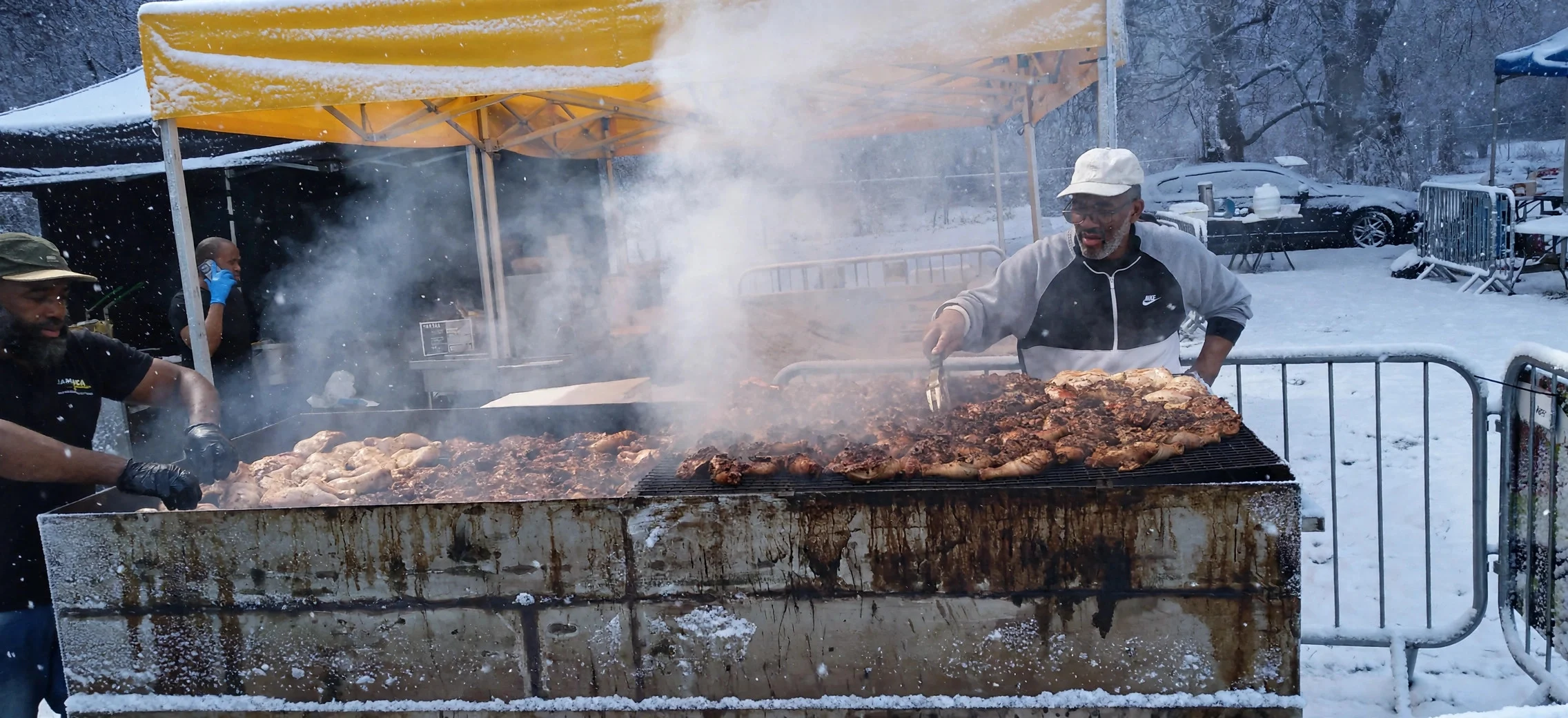 Jerk chicken quarters grilling over glowing coals with smoke rising
